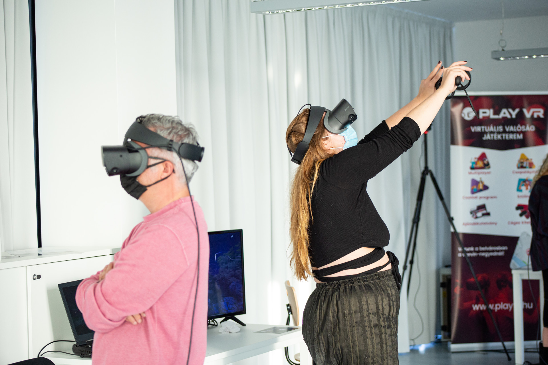 a man and a woman with VR headset